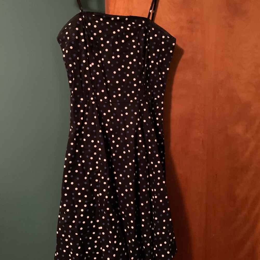 Black dress with blue and white polka dots